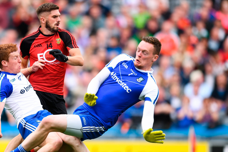 Down’s Connaire Harrison shoots to score his side’s first half goal despite the efforts of Monaghan goalkeeper Rory Beggan and Kieran Duffy during the All-Ireland SFC Round 4B match at Croke Park last week