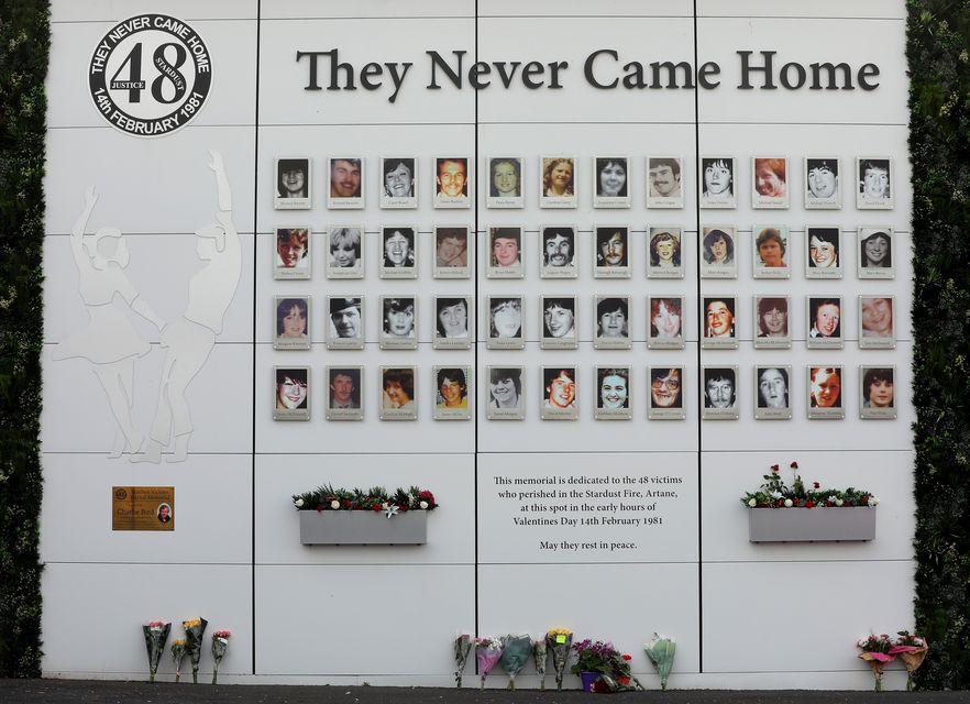 Flowers left for the victims of the stardust tragedy at the memorial wall at the site in Artane (Picture: Gerry Mooney)