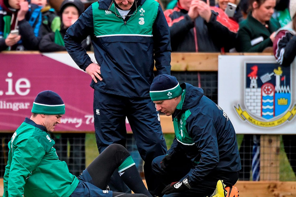 Johnny Sexton receives tratment on an ankle injury he picked up during the Irish squad session in Mullingar yesterday - the Irish No.10 is expected to be back in training on Monday. Photo: Sportsfile