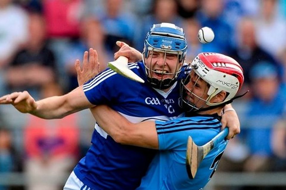 Stephen Maher, Laois, in action against Cian O'Callaghan, Dublin