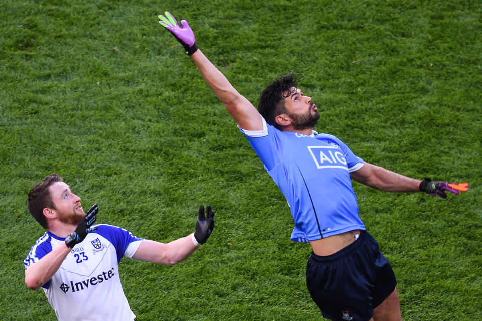 Dublin’s Cian O’Sullivan cuts out an attempt ball to Monaghan’s Owen Duffy