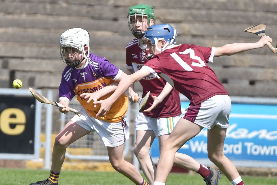 Donal Dwyer of Wexford CBS is outnumbered by FCJ's Jack Quigley and Conor Lacey. Photo: Jim Campbell