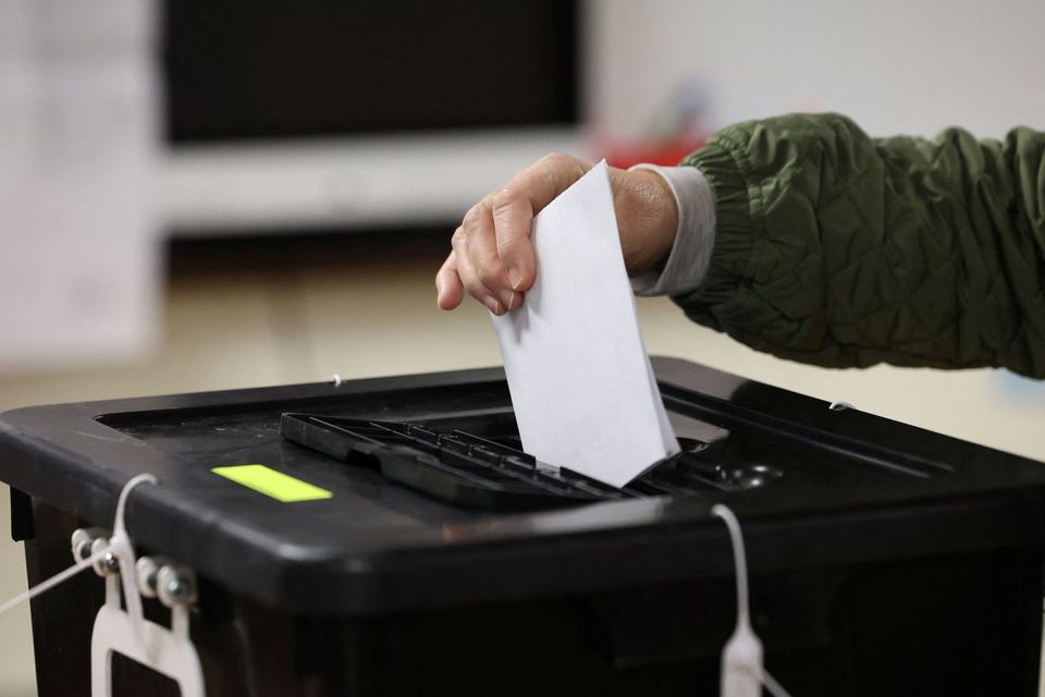 Voter at a polling station in Cork during last year's general election. Photo: Reuters.