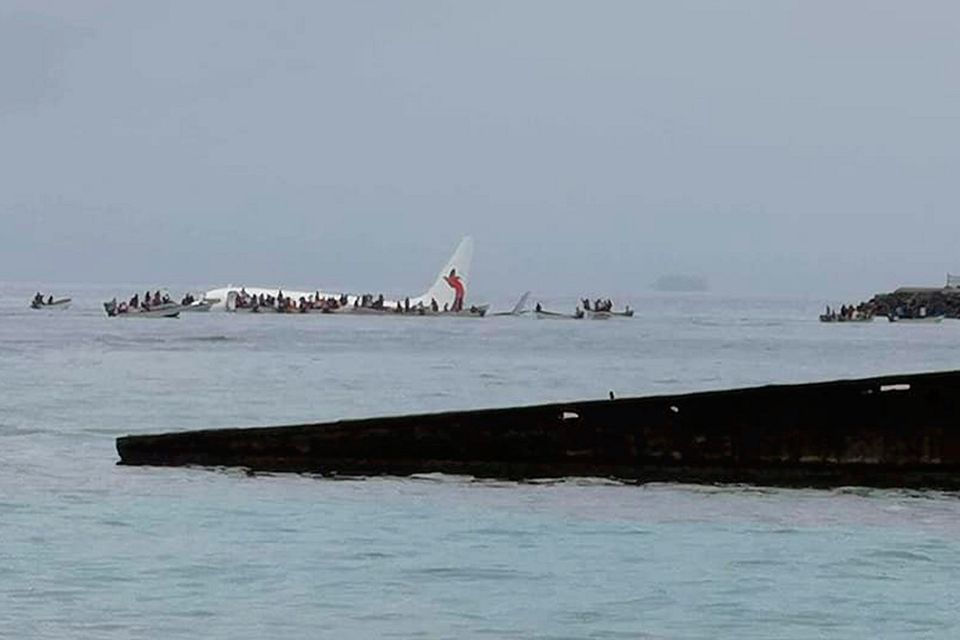 People are evacuated from an Air Niugini plane which crashed in the waters in Weno, Chuuk, Micronesia, September 28, 2018 in this picture obtained from social media. Blue Flag Construction/via REUTERS
