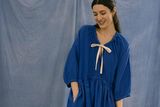 thumbnail: The Gathered bow dress in blue Irish Linen, €335, niamhoneill.com