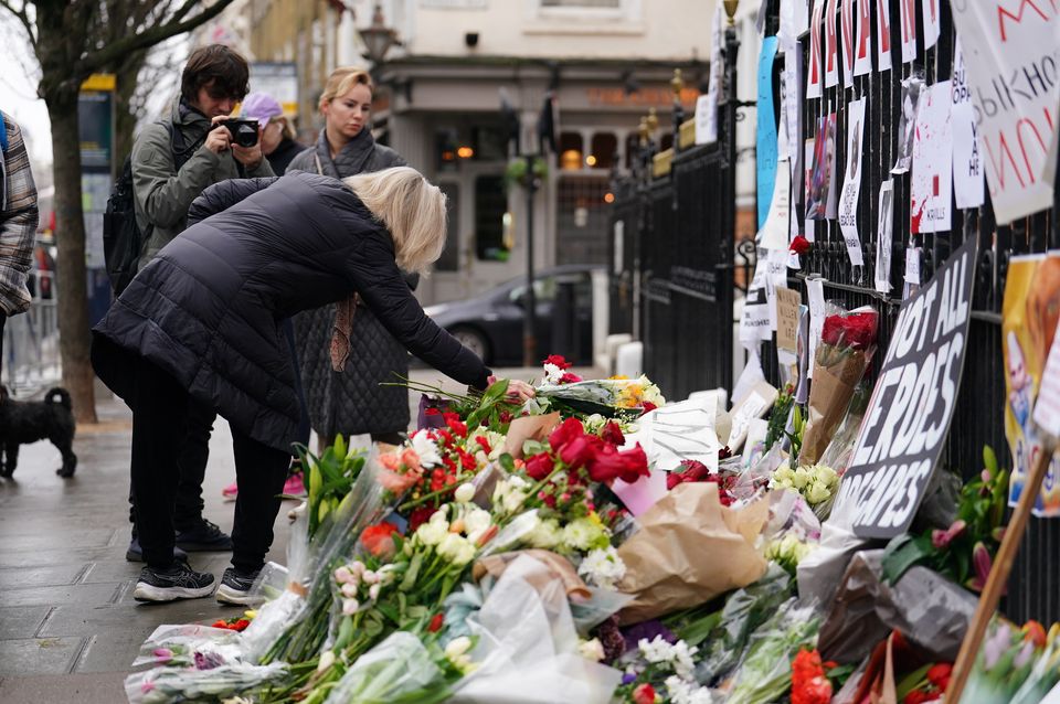 Floral tributes outside the Russian Embassy in London (Jordan Pettitt/PA)