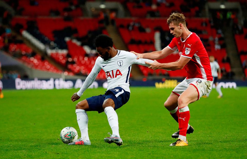Tottenham's Georges-Kevin Nkoudou in action with Barnsley's Liam Lindsay Photo: Reuters/Matthew Childs