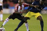 thumbnail: Southampton midfielder Victor Wanyama challenges Sheffield United's Jamal Campbell-Ryce during their Capital One Cup quarter-final clash at Bramall Lane. Photo: Lynne Cameron/PA Wire