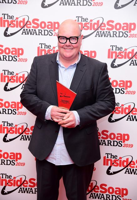 Dominic Brunt with an Inside Soap Award in 2019 (Ian West/PA)