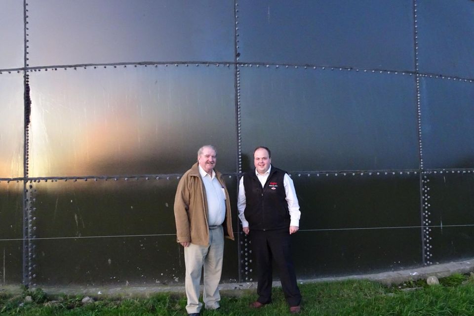 Cllrs Kevin Sheahan and Adam Teskey at one of the affected farmer’s slurry towers in County Limerick