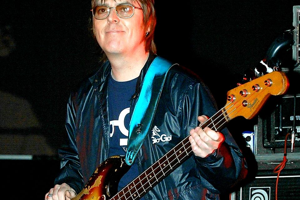 Andy Rourke on stage with Badly Drawn Boy during the Manchester Versus Cancer charity concert in 2006 (PA)