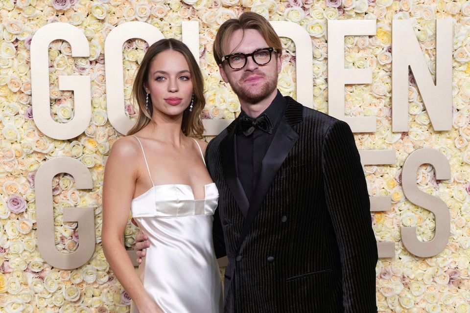 Claudia Sulewski, left, and Finneas arrive at the 81st Golden Globe Awards on Sunday, Jan. 7, 2024, at the Beverly Hilton in Beverly Hills, Calif. (Photo by Jordan Strauss/Invision/AP)