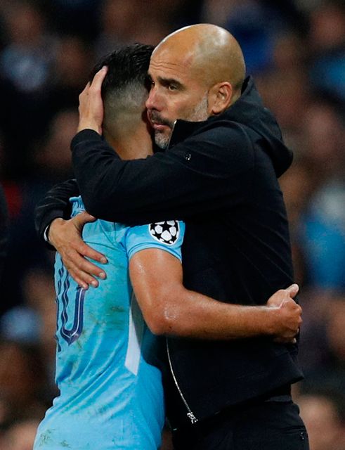 Manchester City's Sergio Aguero with manager Pep Guardiola as he is substituted. Photo: Reuters
