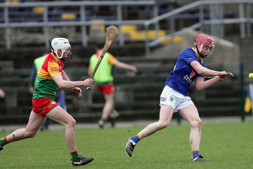 Wicklow's Max Kehoe is chased by Carlow's Conor De Lacey.