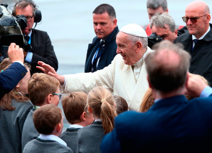 Pope Francis greets school children after arriving at the airport in Knock in County Mayo, as part of his visit to Ireland.
Yui Mok/PA Wire