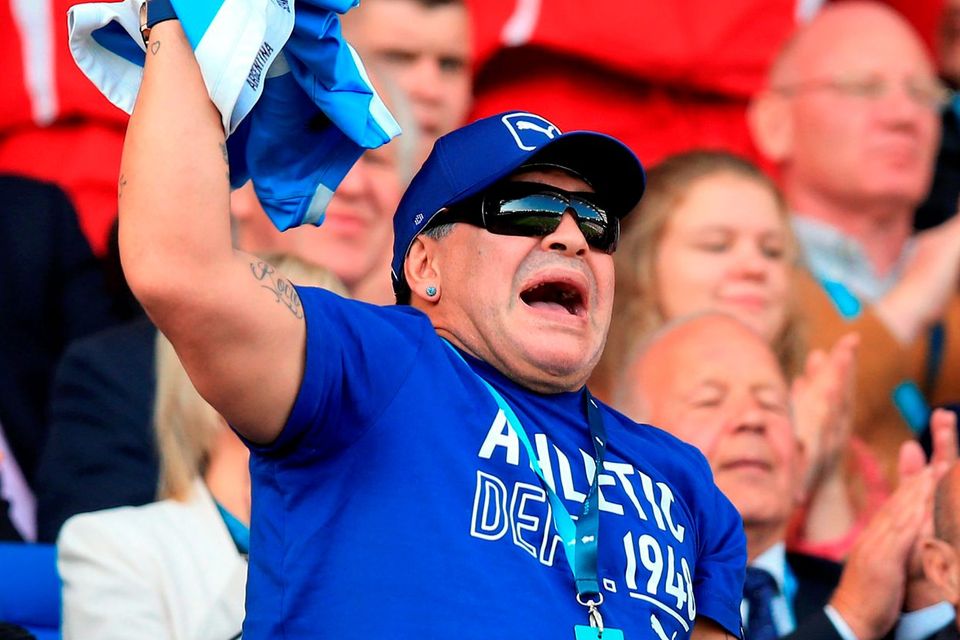 Maradona cheers on his team during the World Cup match at the Leicester City Stadium