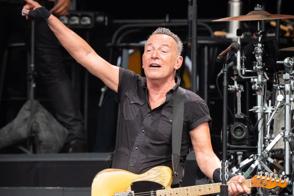 Bruce Springsteen and the E Street Band performing on stage (James Manning/PA)