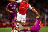 thumbnail: Arsenal's Alex Oxlade-Chamberlain evades a sliding tackle from Galatasaray midfielder Wesley Sneijder during the Champions League game at the Emirates. Photo: Paul Gilham/Getty Images