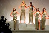 thumbnail: Top models (from left) Carla Bruni, Claudia Schiffer, Naomi Campbell, Cindy Crawford and  Helena Christensen pose at the end of the show for fashion house Versace during the Women's Spring/Summer 2018 fashion shows in Milan, on September 22, 2017.  / AFP PHOTO / Miguel MEDINAMIGUEL MEDINA/AFP/Getty Images