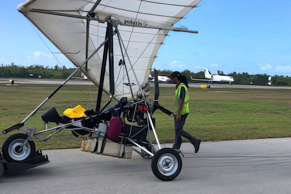Key West International Airport personnel examine an ultralight aircraft that landed illegally at the airport carrying two Cuban men (Monroe County Sheriff’s Office/The Florida Keys News Bureau/AP)
