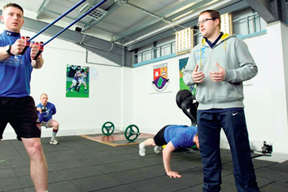 Longford footballer Michael Quinn with strength and conditioning coach David Hare