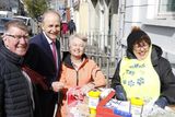 thumbnail: Cllr Ian Doyle, Miceal Martin with daffodil sellers Maura Doyle and Marie O'Brien at the AIB, Main Street, Charleville last Friday.