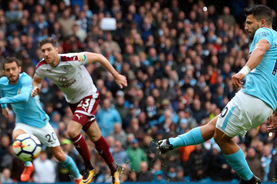 Manchester City’s Sergio Aguero scores his side’s first goal from the penalty spot, equalling Manchester City’s all-time scoring record, during yesterday’s Premier League win over Burnley at the Etihad Stadium. Photo: Martin Rickett/PA