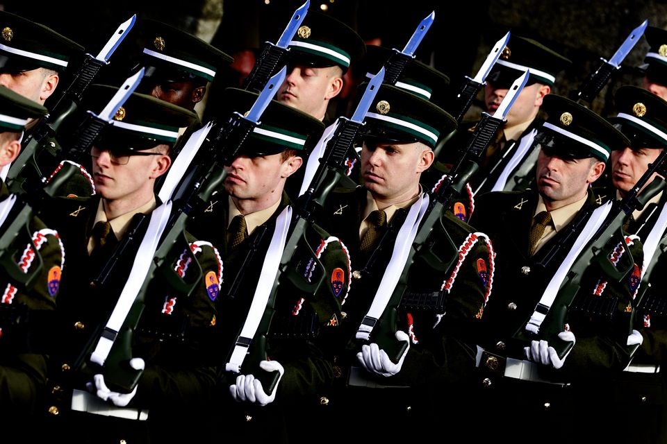 A military guard of honour for the remains of former taoiseach John Bruton as they are taken from St Peter's Church in Dunboyne following his funeral mass.  Picture by Gerry Mooney
