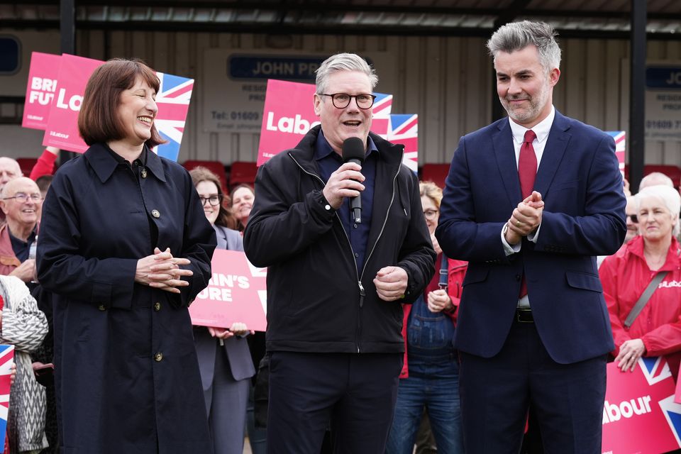 Labour Party leader Keir Starmer (centre) and shadow chancellor Rachel Reeves celebrate with David Skaith at Northallerton Town Football Club (Owen Humphreys/PA)