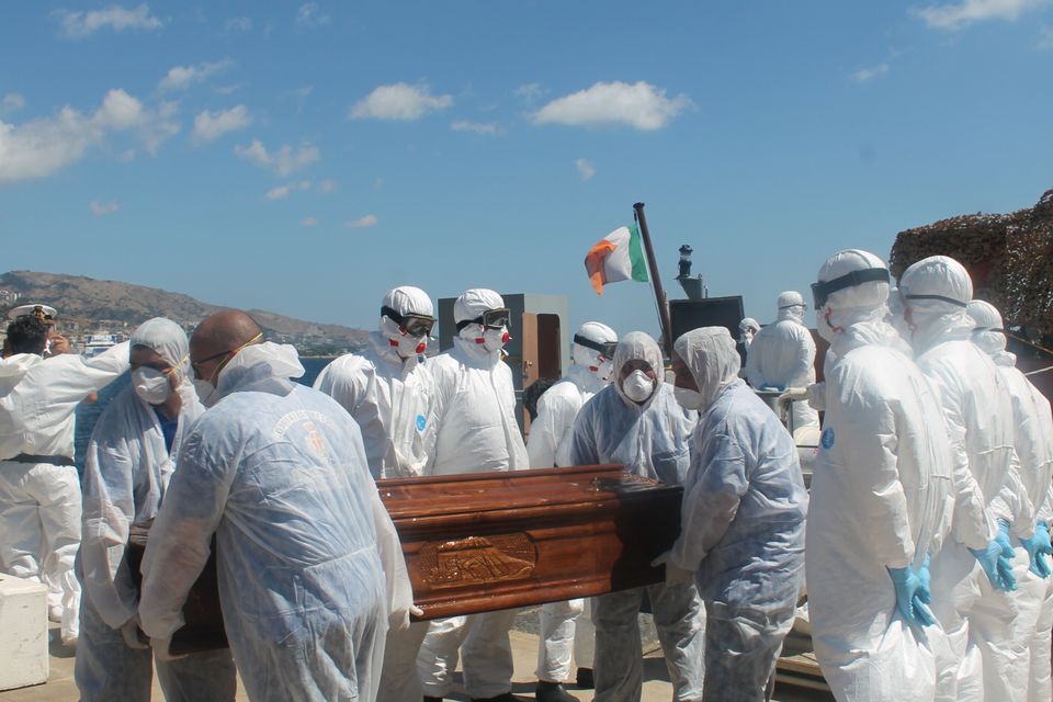 Crew Members of the LE Niamh carry remains from the vessel
Credit: Irish Defence Forces