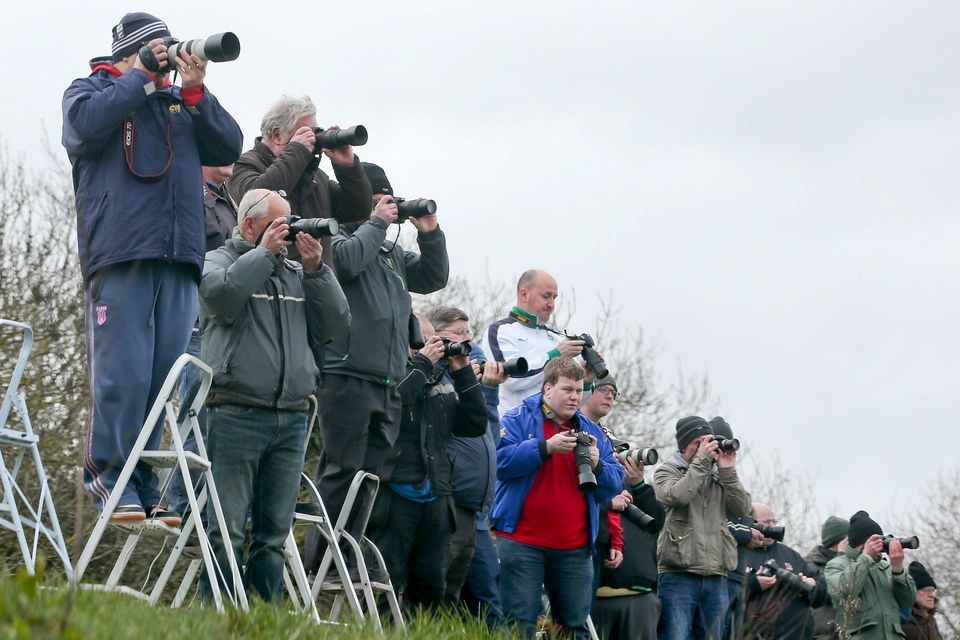 Plane-spotters on 'The Mound' next to Dublin Airport. Photo: Maxwells