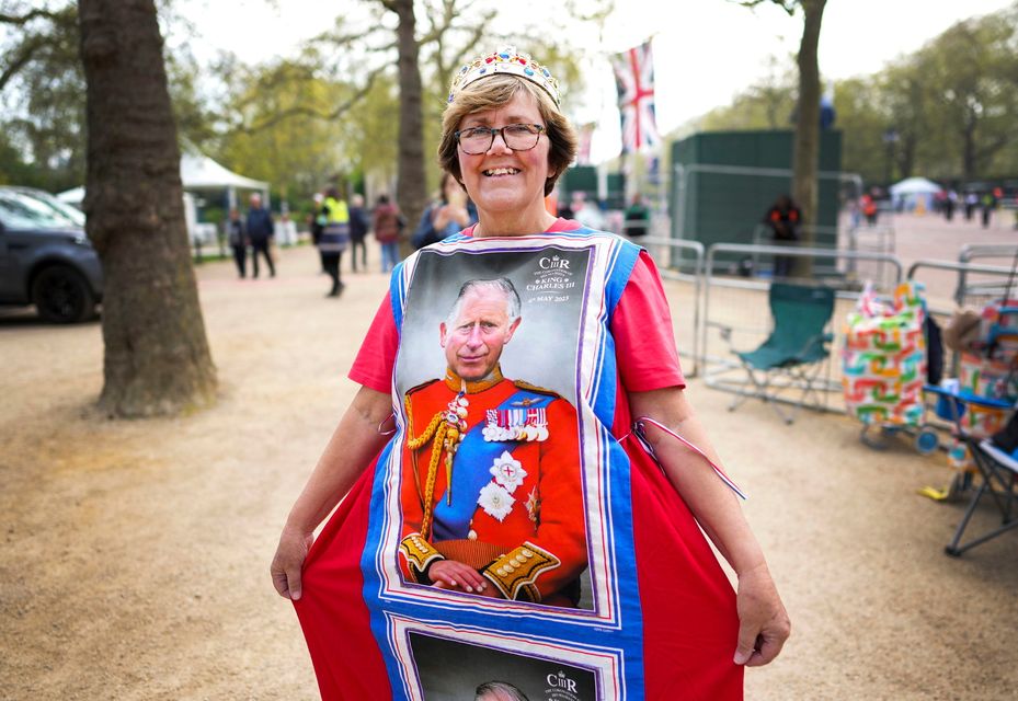 Mandy Ellis shows off her dress made of four tea towels near Buckingham Palace, London, ahead of the the coronation of Britain's King Charles. Photo: Nathan Denette /The Canadian Press via AP