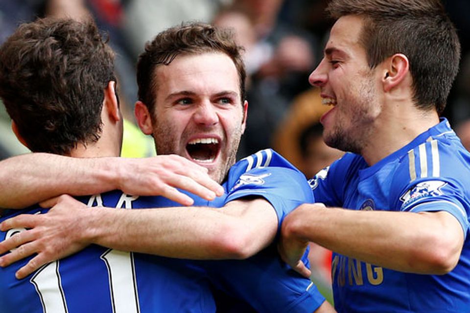 Chelsea's Juan Mata (C) celebrates his goal against Manchester United with teammates Oscar (L) and Cesar Azpilicueta during their Premier League match at Old Trafford.