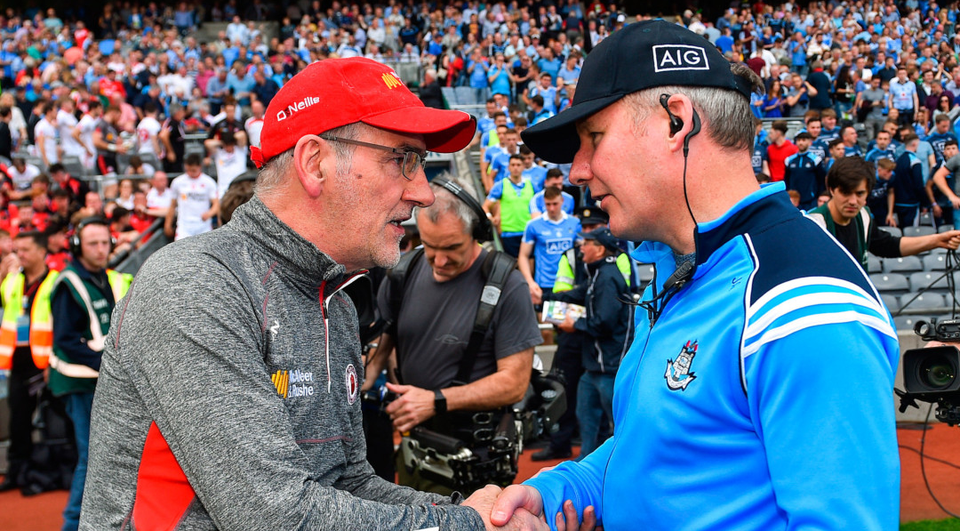 Tyrone manager Mickey Harte shakes hands with Dublin counterpart Jim Gavin after the game