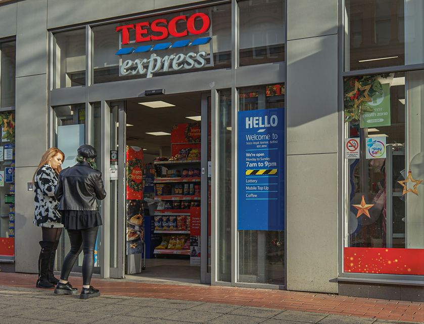 Customers are seen entering a Tesco Express Store. Photo: Getty