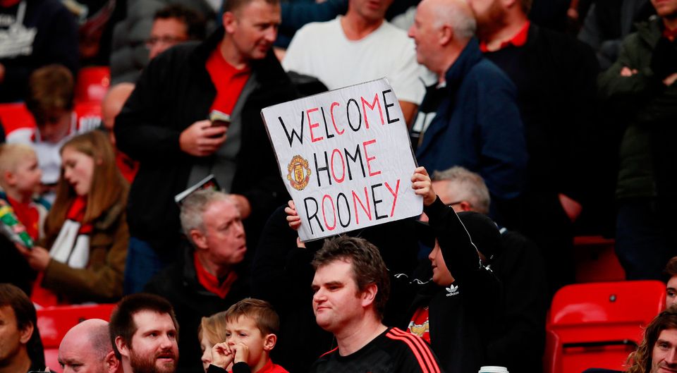 A Manchester United supporter has words of welcome for Wayne Rooney. Photo: Reuters/Jason Cairnduff