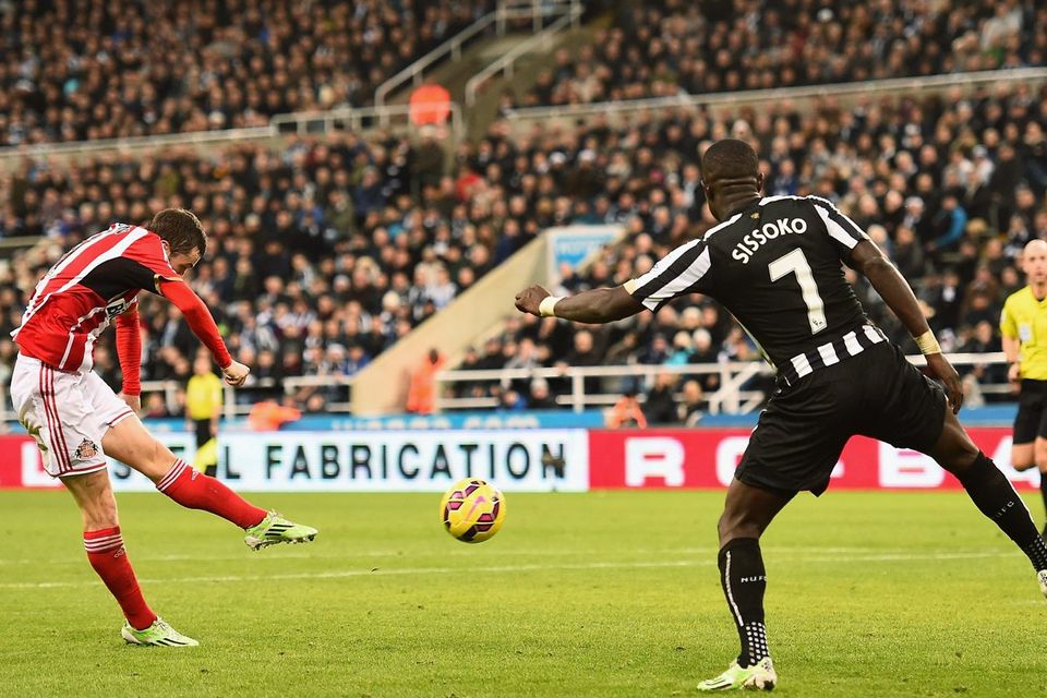 Adam Johnson strikes to score Sunderland's winning goal during their Premier League clash with Newcastle United at St James' Park. Photo: Laurence Griffiths/Getty Images