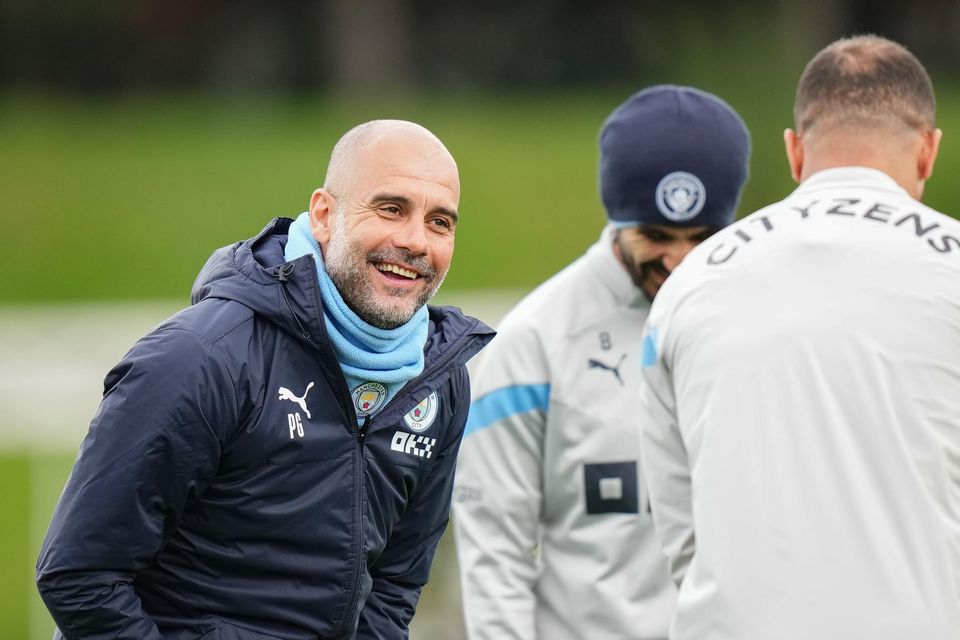 Pep Guardiola and Kyle Walker of Manchester City share a joke during training this week. Photo by Tom Flathers/Manchester City FC via Getty Images