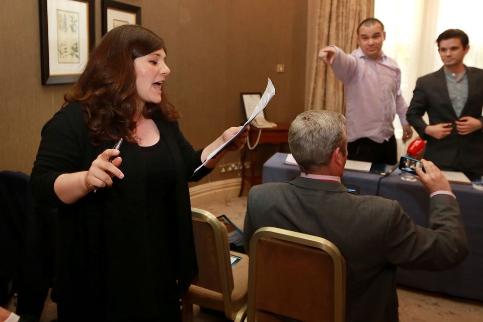 Farah Mokhtareizadeh from Anti Racism Network pictured as she read a statement at the launch of the Identity Ireland, a Pro Sovereignty party in Buswells Hotel. In the background is Gary Allen and Peter O Loughlin, both founder members of Identity Ireland. Photo: Frank McGrath