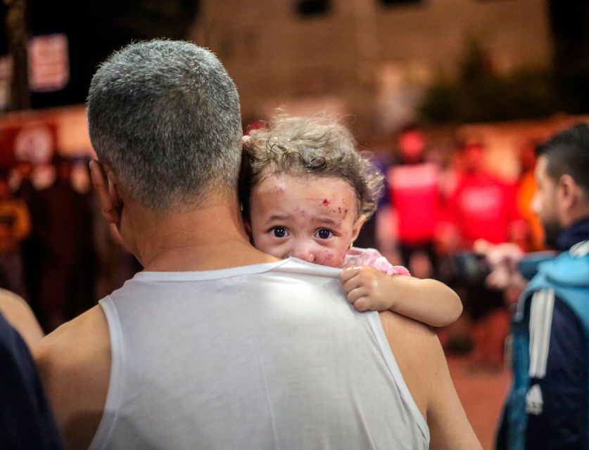 Palestinians injured in Israeli raids arriving in Khan Younis, in the southern Gaza Strip. Getty Images