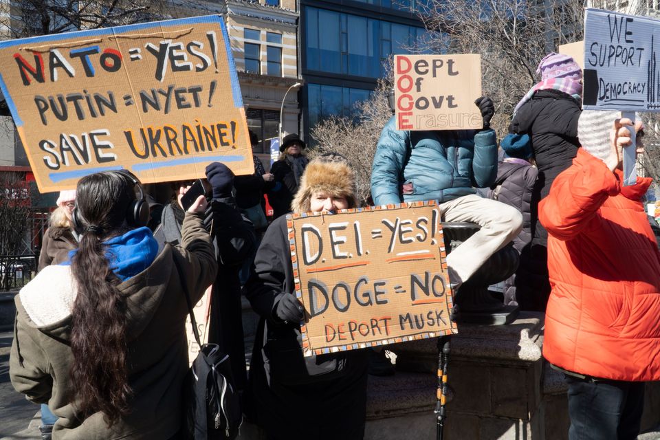 A protester holds a sign in support of DEI in New York’s Union Square earlier this year after attacks on diversity programmes by US president Donald Trump’s administration. Photo: John Senter/UCG/Getty