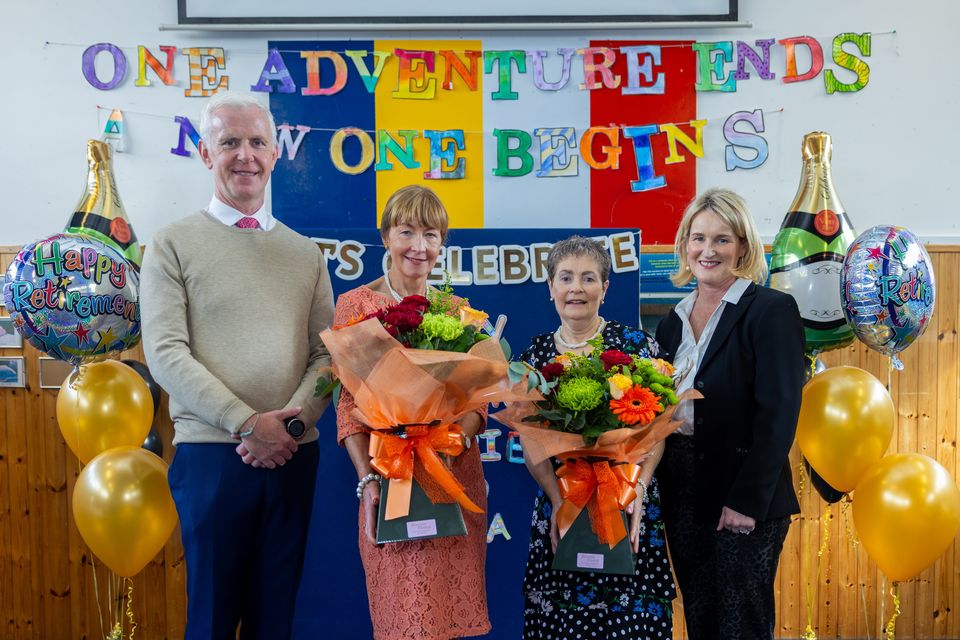 Maria O'Connell (2nd from the left) and Norrie Sheehan (3rd from the left) pictured with Principal Mr. Colm Ó'Súilleabháin and Deputy Principal Sandra Chute (from the right) on their Retirement Day in St Oliver's NS on Wednesday. Photo by Tatyana McGough