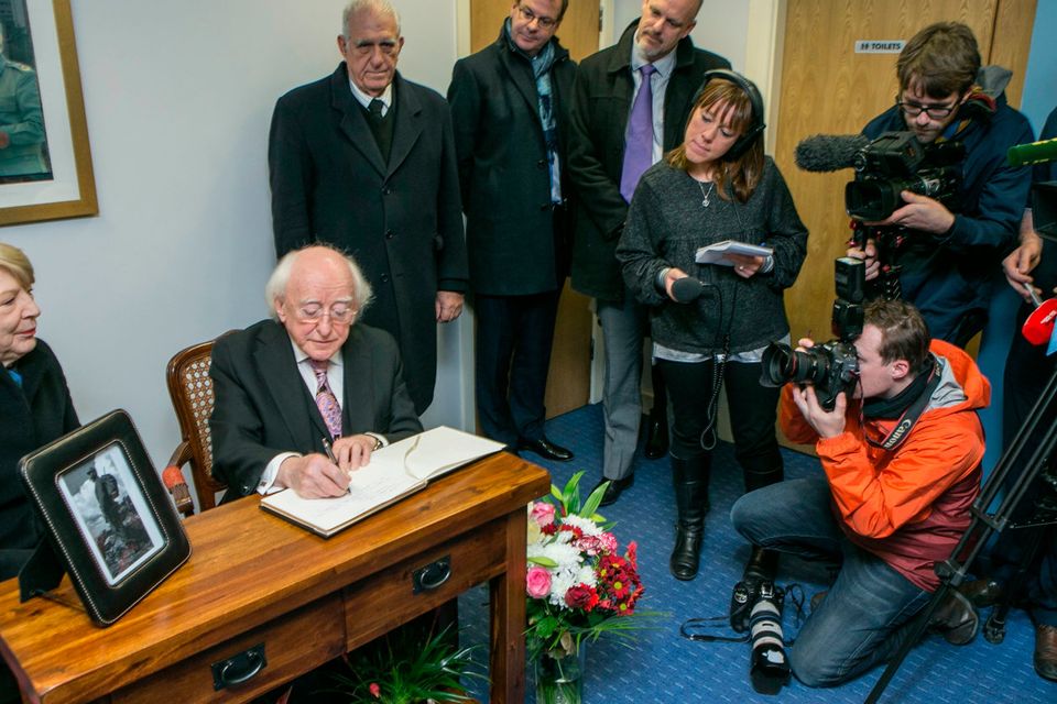 President Michael D Higgins and his wife Sabina signing the book of condolence for the late Fidel Castro at the Cuban Embassy on Pearse St Dublin. Photo: Kyran O'Brien