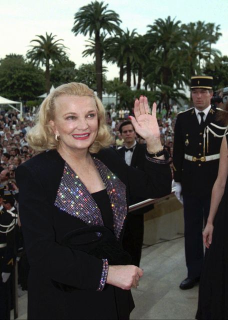 Gena Rowlands waves to the crowd as she arrives at the Festival Palace in Cannes, Tuesday, May 23, 1995 (Laurent Rebours/AP)