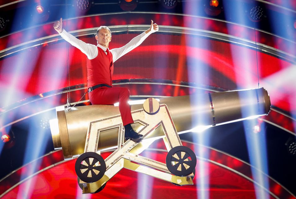 The former footballer was lowered to the dancefloor on a gold cannon (Guy Levy/BBC/PA)