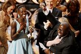 thumbnail: Director and producer Steve McQueen celebrates after accepting the Oscar for Best Picture with Lupita Nyong'o (L) at the 86th Academy Awards in Hollywood, California March 2, 2014.  REUTERS/Lucy Nicholson