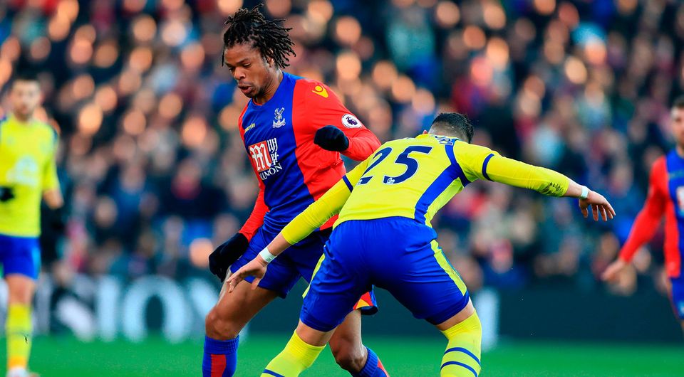 Crystal Palace's Loic Remy (left) and Everton's Ramiro Funes Mori in action. Photo credit: John Walton/PA Wire