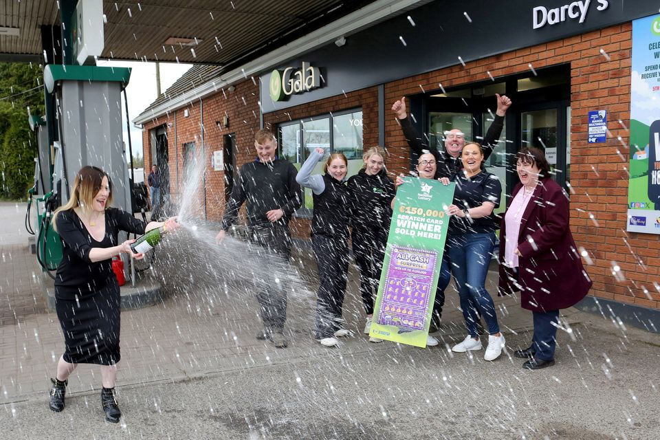 Staff at Darcy’s Filling Station in Mountlucas, Daingean, Co. Offaly were delighted to hear that their store sold an All Cash Surprise scratch card with a top prize amount worth €150,000. Pictured at the celebrations were, from left, Sarah Orr from the National Lottery, Grace Kelly, Sharon Bracken, Cillian Darcy, Nadine Evans, Tom Darcy, Caroline Cronin, Mary Grace Lottery Field Sales at Darcy's Gala service station Mount Lucas, Co. Offaly. Pic: Paul Molloy / Mac Innes Photography