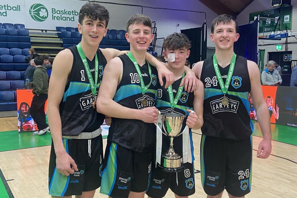 Garvey's Tralee Warriors players with the U-20 League trophy, from left, Phoenix Costello, Gary Lynch, Eoin Creedon and Donal O'Sullivan. Photo by Alan Cantwell