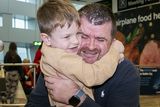 thumbnail: Mike Hoare from Dubai is greeted by his son Donal Hoare (6) at Dublin Airport today. Photo: Gareth Chaney/ Collins Photos